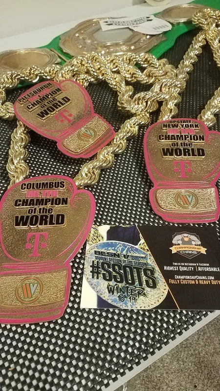 Four gold championship necklaces
